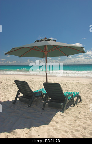 Patio Umbrella and two chaise loungers at Crane Beach Barbados south coast Stock Photo