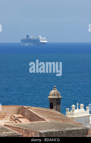 Cruise ship appears behind the Castillo de San Felipe del Morro in old San Juan, Puerto Rico Stock Photo