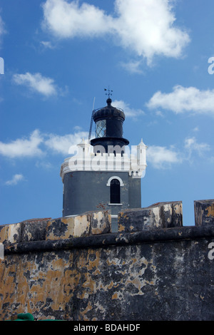 19th century lighthouse sits within the walls of the 16th century Castillo de San Felipe del Morro in old San Juan, Puerto Rico Stock Photo