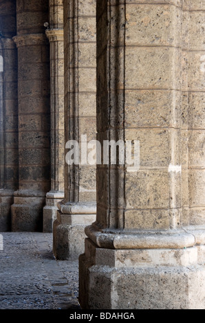 Row of solid travertine columns in Plaza de Armas in Old Havana. Stock Photo