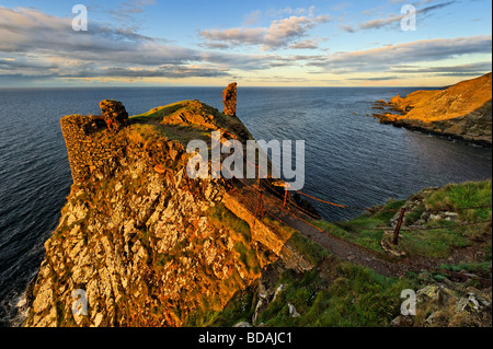 Evening sunlight on the ruins of Fast Castle and the Berwickshire coastline in the Scottish Borders Stock Photo