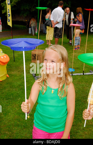 Youngster having a go at plate spinning at Chawton Village Fete, Chawton, Hampshire UK. 08.08.2009. Stock Photo