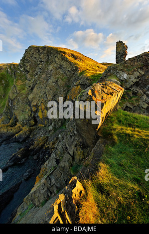 Evening sunlight on the ruins of Fast Castle and the Berwickshire coastline in the Scottish Borders Stock Photo