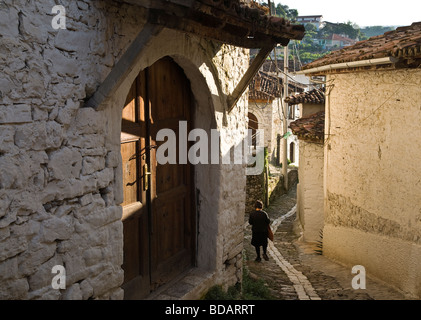 A typical narrow cobbled alleyway with ottoman period houses in the Mangalemi district of Berat in central Albania Stock Photo