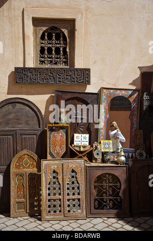Reflection of an attractive blond tourist in a mirror for sale in the Souk, Medina, Marrakesh, Morocco, North Africa Stock Photo