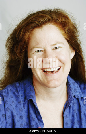 Studio portrait of mature woman laughing Stock Photo - Alamy