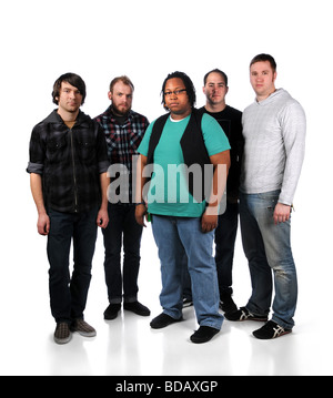 Group of five young men standing over a white background Stock Photo