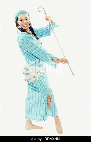Portrait of a female dancer holding a cane and smiling Stock Photo