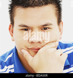 Portrait of a young man thinking Stock Photo