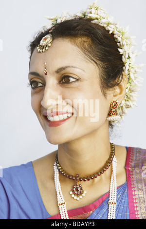 Close-up of a mature woman smiling in traditional clothing Stock Photo
