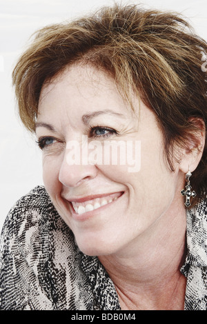 Close-up of a mature woman smiling Stock Photo - Alamy