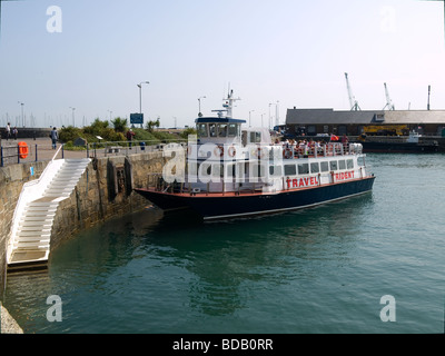 A Travel Trident ferry arriving at St Peter Port from Herm a regular service Stock Photo
