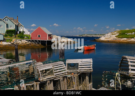 Lobster traps on the wharf in an inlet to the quiet fishing village of Peggy's Cove Nova Scotia Stock Photo