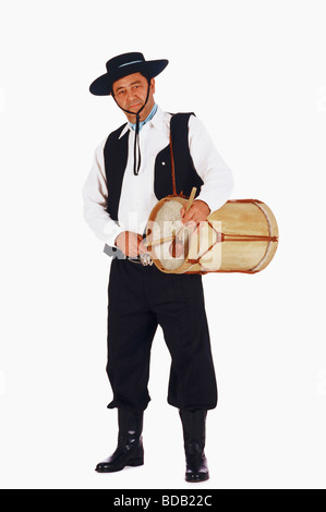 Portrait of a mature man playing a drum Stock Photo