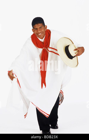 Portrait of a young man holding a hat and smiling Stock Photo