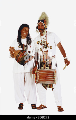 Portrait of a mid adult couple with a drum and shekere Stock Photo