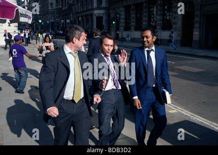 three young men sharing a joke in the city of london Stock Photo