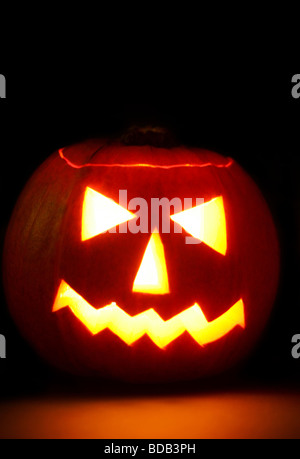 Carved pumkin glowing in the dark Stock Photo - Alamy