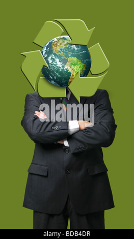 Global recycle business metaphor against a green background Stock Photo