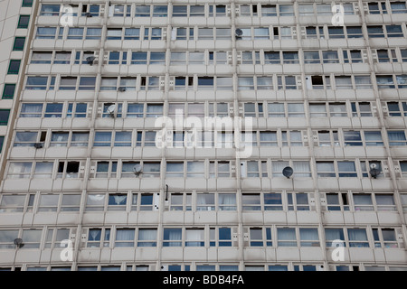 Windows of a council flat housing block in Deptford South East London. This high rise block is in some disrepair Stock Photo