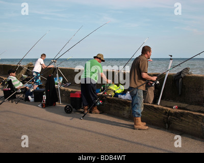 Fishing from Harbour wall at Bridlington East Yorkshire UK Stock Photo