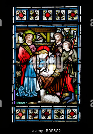 A Stained glass window of 1872 by Bell & Almond depicting the Nativity Earls Barton Church Northamptonshire Stock Photo