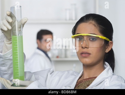Scientist holding a burette Stock Photo