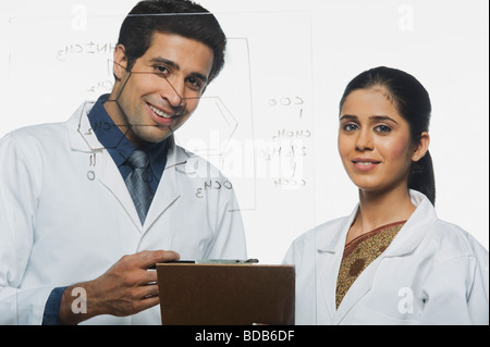 Scientists at work on a problem Stock Photo