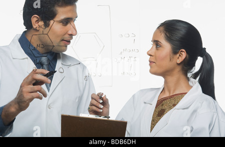 Scientists at work on a problem Stock Photo