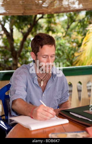 Indonesia Sulawesi Kaledupa Island Ambuea researcher discussing fisheries project Stock Photo