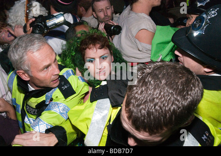 Climate Rush protest on 100th anniversary of Suffragette rush on Parliament - struggles at the door of Parliament Stock Photo