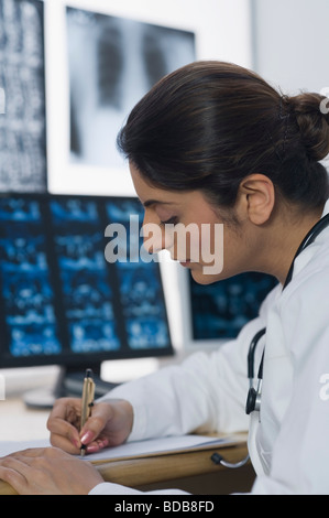 Female doctor writing a prescription Stock Photo