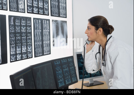Female doctor talking on a phone Stock Photo