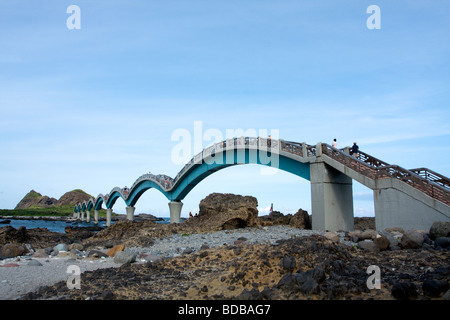 The iconic eight-arch footbridge and a small island off the coast at Sanxiantai in Taitung, Taiwan Stock Photo