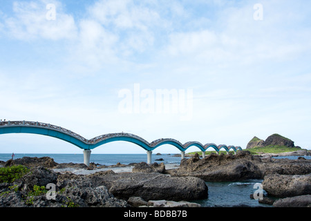 The iconic eight-arch footbridge and a small island off the coast at Sanxiantai in Taitung, Taiwan Stock Photo