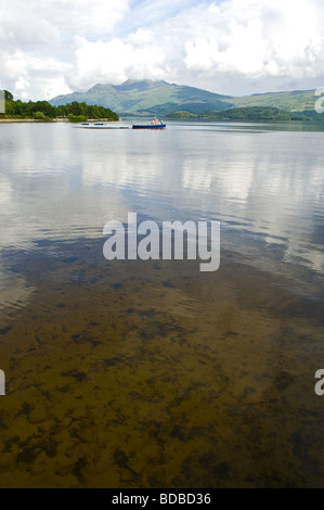 Pleasure or tourist sightseeing boat on Loch Lomond just off a village called Luss, Scotland. Stock Photo