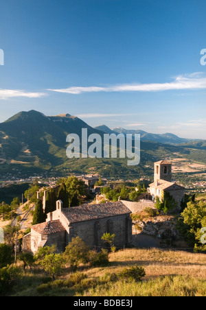 First morning light on the church in Courbons, Provence, France Stock Photo