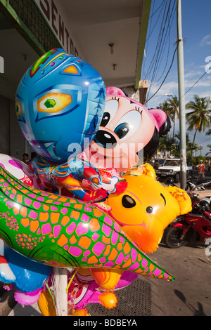 Indonesia Sulawesi Makassar Jalan Penghibur Walt Disney character balloons outside shop Stock Photo