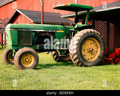 older john deere green tractor on grass Stock Photo