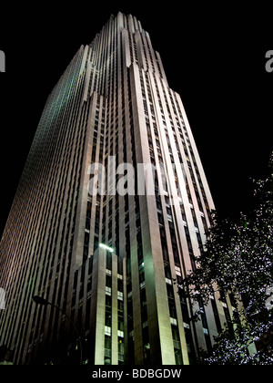 Rockefeller Center building in New York City at night  and lighted with spot lights and trees with small lights. Stock Photo