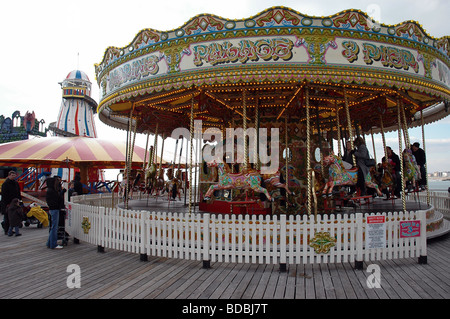 Merry go round and helter skelter on Brighton Pier Stock Photo
