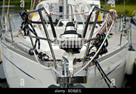 Front bow of a sailing boat showing anchor, ropes and safety rail. Stock Photo