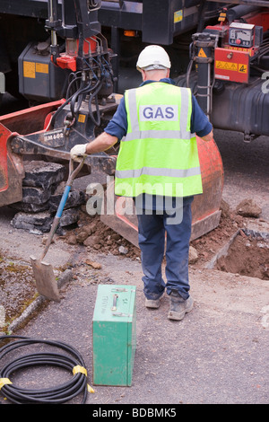 British Gas workers replacing old metal gas pipes with plastic ones Stock Photo