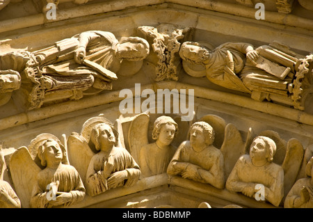 Stone carving above the main entrance at Notre Dame Cathedral in Paris Stock Photo