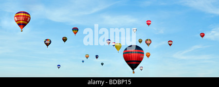 Panoramic of colourful hot air balloons taken on summers day against a blue sky at the 2009 Bristol Balloon fiesta uk Stock Photo