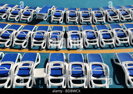 Sun Loungers on cruise deck during sunny day Stock Photo