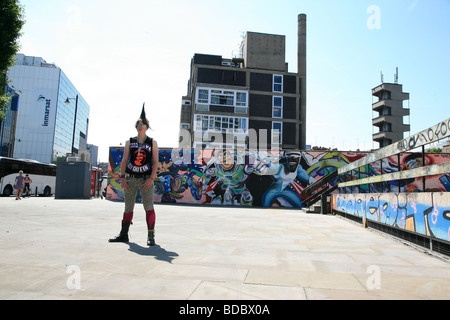 A punk girl 'Rae Ray Riots' with a large Mohican, Shoreditch, London, UK .2009