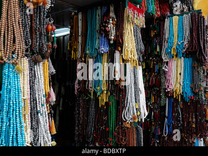 tibetan buddhist  religious beads items objects on sale in the market bazaar near Boudhanath temple shrine buddhist temple Stock Photo