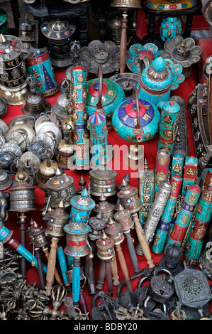 tibetan buddhist  religious items objects on sale in the market bazaar near Boudhanath temple shrine buddhist temple Stock Photo