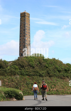 Man and woman walkers at Doyle Column at Jerbourg Point Guernsey Channel Islands Stock Photo